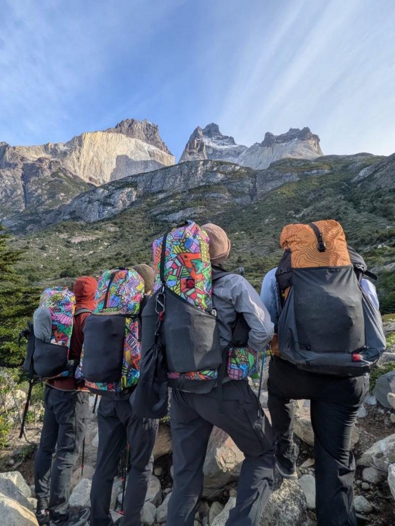 Four custom Red Paw packs in printed DCF on hikers in Patagonia