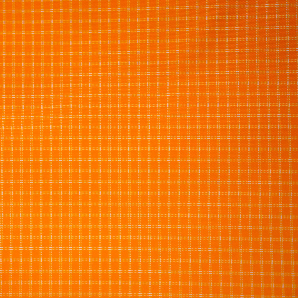 Close-up of orange Challenge UltraGrid fabric showing the UHMWPE ripstop grid