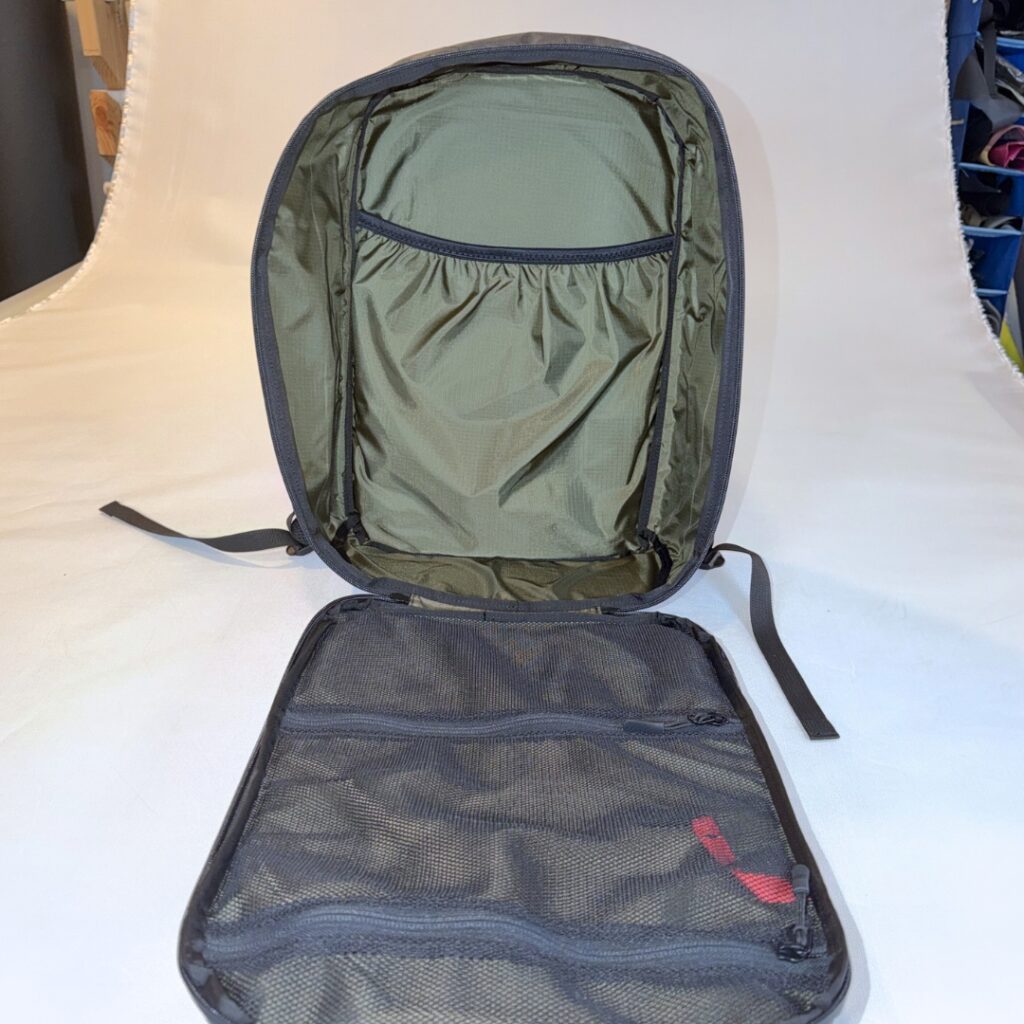 Scrambler 17L EDC backpack opened to show its Dark Olive ROBIC nylon interior