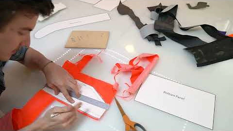 Matt tracing and cutting pattern pieces from orange fabric